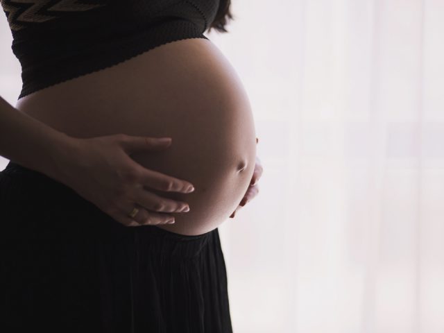 Woman Holding Belly
